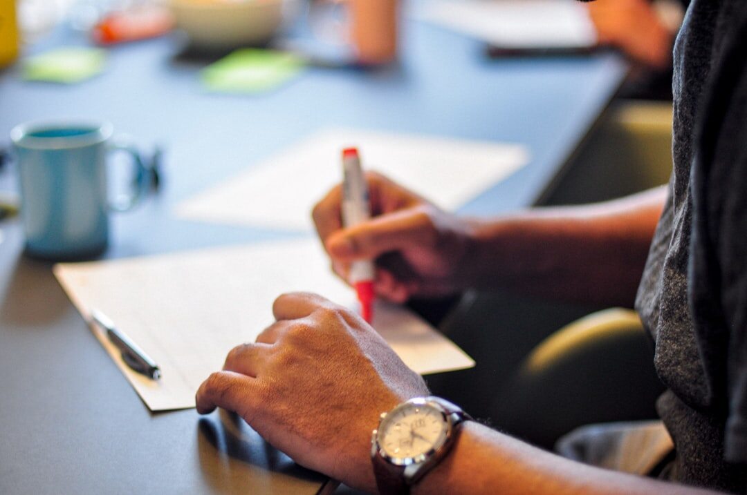 person planning goals on paper